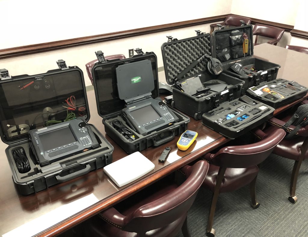 TSCM bug sweep technician checking for hidden cameras listening devices and GPS trackers in Canberra
